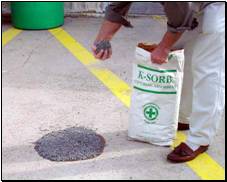 Using an absorbent to clean up a spill