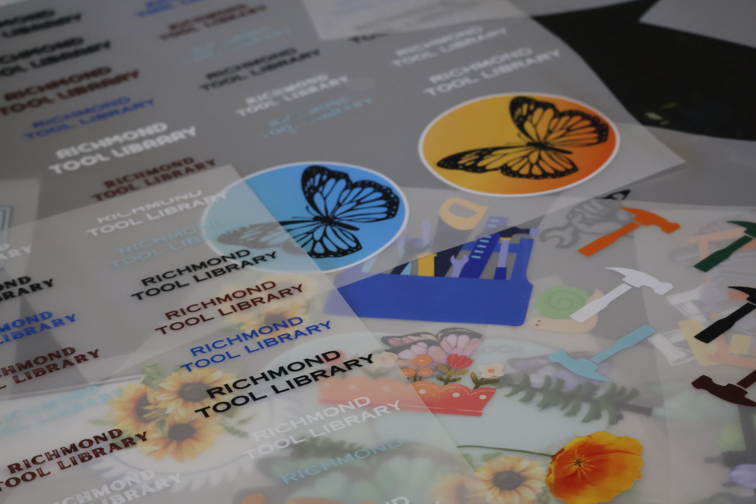 Photograph of colorful designs and text that read Richmond Tool Library